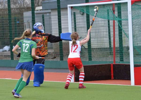 Beth McVeigh (No 12) scores Larne Ladies only goal in their 2-1 defeat to Ballymena Ladies at Larne Grammar School. INLT 04-007-PSB Photo: Phillip Byrne