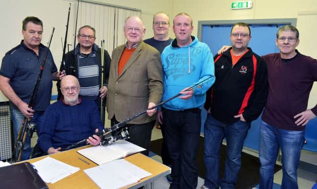 Photographed in Tullygarley Hall last week were members of Gracehill and Galgorm Angling Club with some of the fishing equipment they seized from illegal anglers which was presented the Trevor Green, First Cast NI. INBT 06-814H.