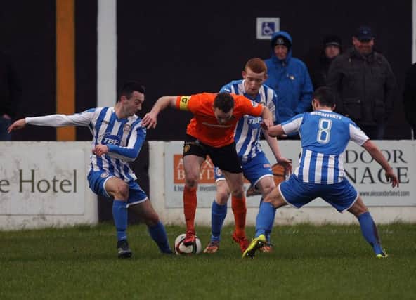 Carrick's Captain Aaron Harmon and Coleraine's Rodney Brown, Mark Edgar and Neil McCafferty. Picture by Freddie Parkinson/Press Eye
