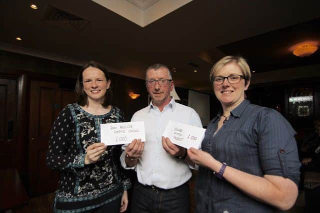 John Steele, Chair of the Traction Club of Ulster, is pictured presenting cheques to Nichola Wallace, for the Craniofacial Unit, and Caroline Patterson, for the Chipalawe Orphanage.