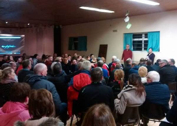 Hundreds attend a meeting of locals opposed to the creation of a gold mine in the Sperrin Mountains
