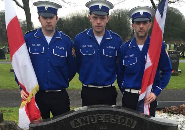 Members of the Constable Anderson Memorial Flute Band committee, William Sharples, Ryan Girvan and Graham Perry lay a wreath at the grave of Constable Norman Anderson to mark the 55th anniversary of his death.  Read more on page 27. INLT 04-658-CON