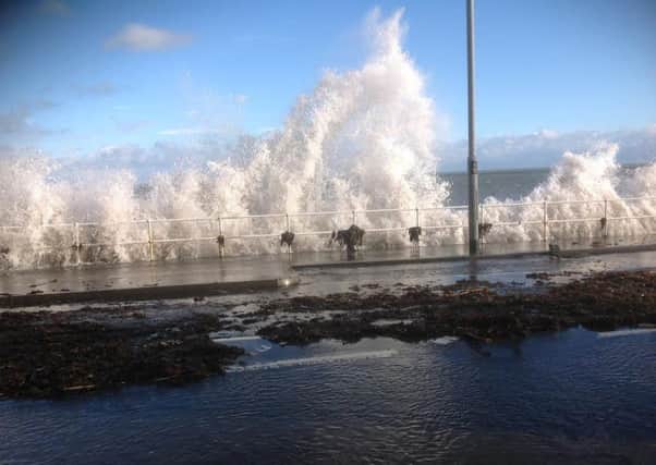 The Coast Road at Carnlough flooded with a foot of water on Tuesday January 26 due to a high tide and strong winds whipped up by Storm Jonas. INLT-04-707-con