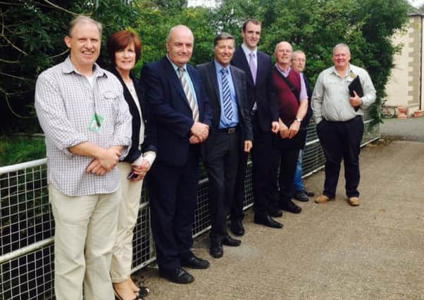 Minister Mark H Durkan (fourth from right) pictured with South Antrim MLAs Trevor Clarke and Paul Girvan, Cllr Noreen McClelland, Michael Martin, Six Mile Water Trust, Maurice Parkinson, Chairman of Antrim & District Angling Association, Robbie Marshall, Ulster Angling Federation, and Sam Curry, Six Mile Water Trust. The Minister met the delegation at Patterson's Spade Mill last September to discuss fish kills on the Ballymartin and Sixmilewater rivers.
