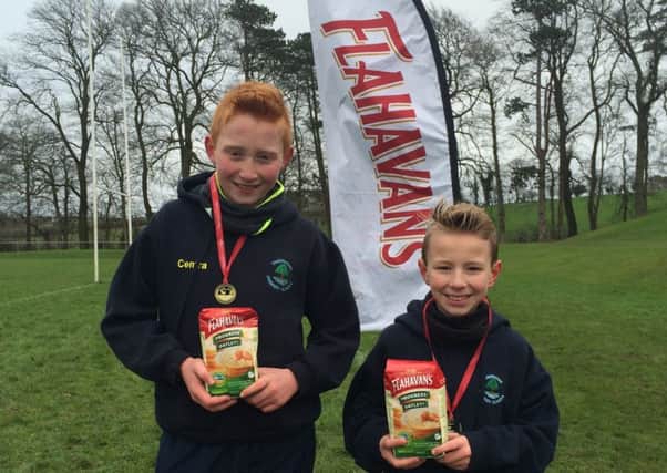 Josh Rooney (left) and Jacob McIlwaine came home first and third respectively in the Southern section at the latest Flahavans Porridge Athletics NI Primary School Cross-Country League meeting.