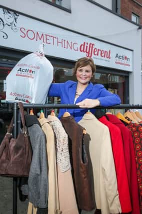 Radio Personality, Denise Watson de-clutters her wardrobe and donates clothes to Action Cancer.