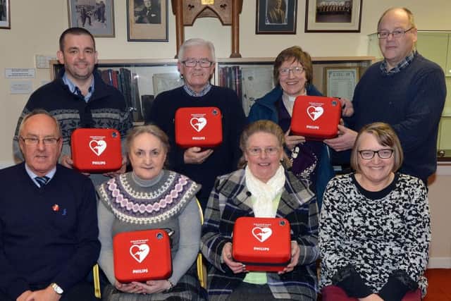 Pictured at the handover of the defibrillators are back row from left, Alan Carson, Bethany Free Presbyterian Church, Rodney Myles, Edenderry Methodist Church, and Rev Christina Bradley and Ivan Conner, Armagh Road Presbyterian Church. Front from left, Rodney Wiggins, honorary secretary, CCCA, Muriel Mander, Portadown Independent Methodist Church, Sally Anderson, Carelton St Orange Hall, and Noeleen Hampton, treasurer, CCCA. INPT05-201.