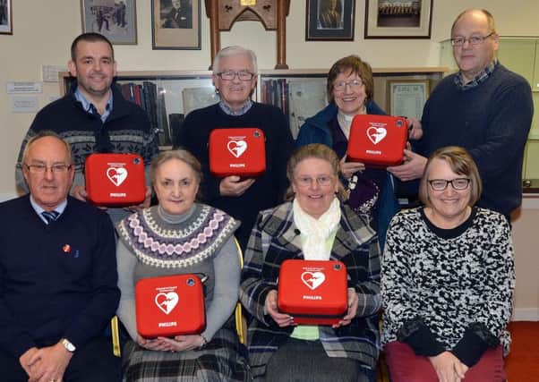 Pictured at the handover of the defibrillators are back row from left, Alan Carson, Bethany Free Presbyterian Church, Rodney Myles, Edenderry Methodist Church, and Rev Christina Bradley and Ivan Conner, Armagh Road Presbyterian Church. Front from left, Rodney Wiggins, honorary secretary, CCCA, Muriel Mander, Portadown Independent Methodist Church, Sally Anderson, Carelton St Orange Hall, and Noeleen Hampton, treasurer, CCCA. INPT05-201.
