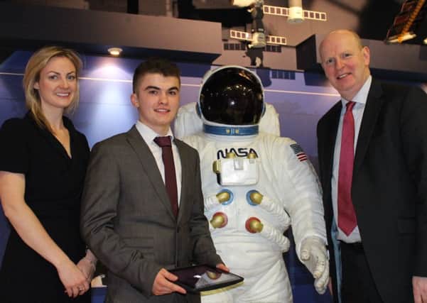 Competition award winner Alexander Gillanders with Sinead OSullivan, former NASA research scientist and SRC student, and SRC chief executive Brian Doran. INPT05-014