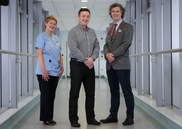 Cancer patient Ken McBride with his Clinical Research Nurse Adrina ODonnell and Professor Joe OSullivan, Clinical Director, N.I. Cancer Centre.  INCT 05-721-CON