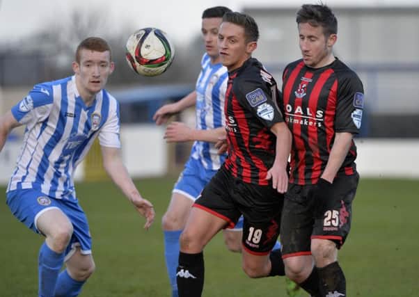 Coleraine's Rodney Brown  in action with Crusaders' Mathew Snoddy