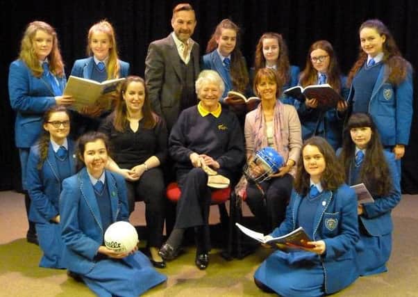 Dame Mary with girls from St Mary's choir who will be singing for her Trust