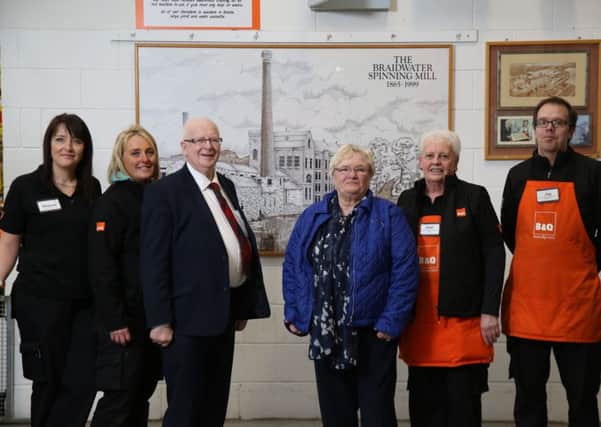 Mid & East Antrim Borough Councillor Beth Adger and Alderman Tommy Nicholl pictured accepting the original painting of the historic Braidwater Spinning Mill that occupied the site of B&Q in Ballymena for well over a century from store Manager, Jay Smit. Also pictured are members of staff, Sharon Watson (left), Natasha Blair, and Joan McIlhagga (right).