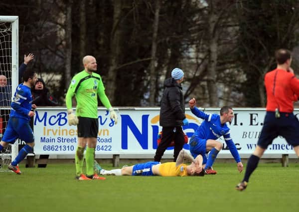 A picture that perfectly encapsulates Ballymena United's afternoon at Ballinamallard as defender Paddy McNally puts the ball into his own net for the home side's third goal. Picture: Press Eye.
