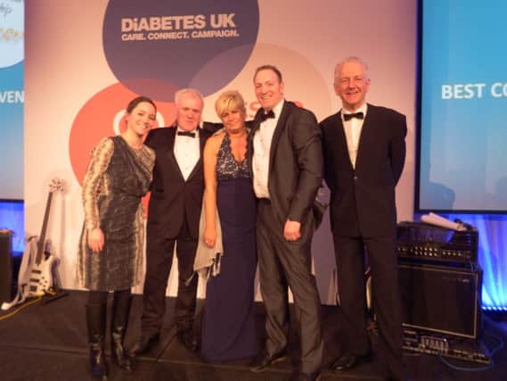 left to right: Caroline Silke, Head of Community at Tesco, parents of the late Kris Niblock, Peter and Hillary Niblock, Grahaem Agnew, Store Manager at Tesco Lisburn, and compere Pavel Douglas