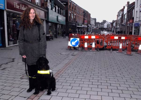 Joanna Toner beside some of the public realm works in Bow Street, Lisburn