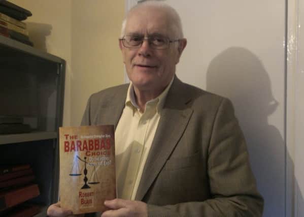 Roy Blair with his new book, The Barabbas Choice. INLT-05-710-con