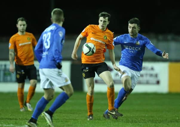 Carrick's Daniel Wallace in action with Glenavon's Eoin Bradley. Photo: Presseye