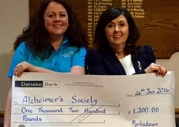 Anne Fox (right, lady captain) presents a cheque for Â£1,200 to Maeveen McNabb (The Alzheimer's Society, community fundraiser SW NI) following the ladies' section's Winter League at Portadown.