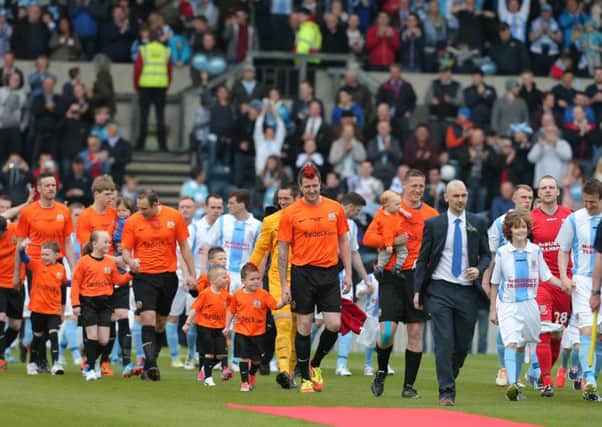 Mark Farren leads Glenavon out in the 2014 Irish Cup final.