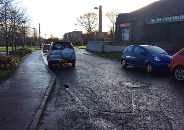 Parked cars blocking the Metro bus route at The Glade, Mossley on Wednesday morning.