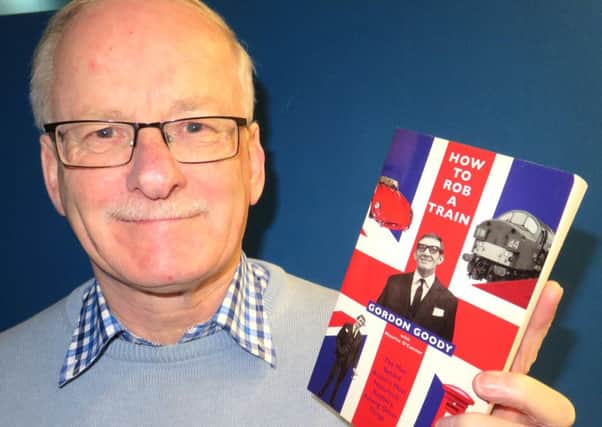 Ronnie Harkness with his book which was signed by The Great Train Robber Gordon Goody. INPT05-040