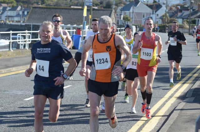 (File photo) Runners making their way through Ballygally in a previous  Larne Half Marathon. INLT 13-343-PR