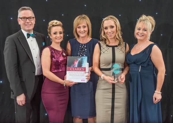 Southern Trust Executive Director of Nursing and Allied Health Professionals Mr Francis Rice, who compered the Awards event, Head of Diagnostics, Jeanette Robinson and Craigavon Area Hospital Radiographers, Janet Eagle, from Portadown, Helena Kincaid from Lurgan who were the overall winners at the 2016 Advancing Healthcare Awards.