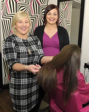 Louise McFaul (Cut N Style, Dromore) prepares to cut Chelsy Corbetts' long hair which she is donating to the Little Princess Trust, included is Mum Â©Edward Byrne Photography INBL1606-213EB