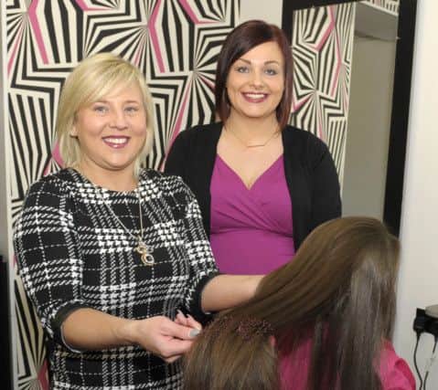 Louise McFaul (Cut N Style, Dromore) prepares to cut Chelsy Corbetts' long hair which she is donating to the Little Princess Trust, included is Mum Â©Edward Byrne Photography INBL1606-213EB