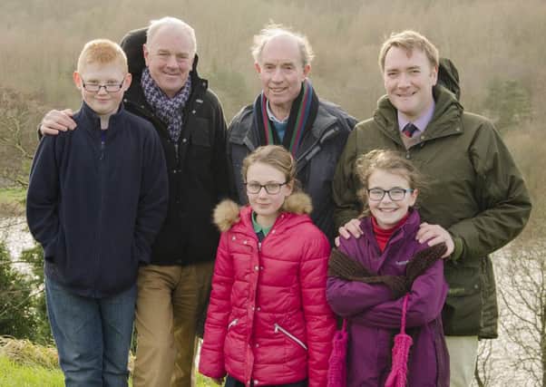 Derek Sinnamon, Liam Hickey and Robert Aiken with schoolchildren James O'Kane, Maebh Hickey and Annabell Aiken at the Mountsandel site. INCR04 004BW