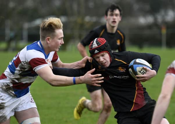 Foyle's Conall Gill battles to hold off this tackle from Dalriada player Stewart Moore. INLS0616-109KM