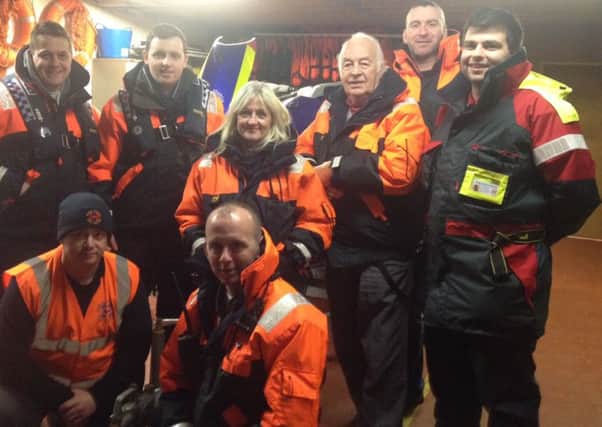 Graham Warke and Gary Middleton, standing, left, with the members of Foyle Search and Rescue.