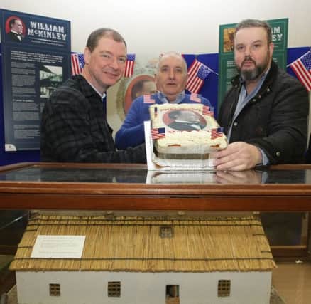 DERVOCK'S PRIDE. Peter Thompson (centre), main organiser of the President McKinley Birthday celebrations on Saturday, pictured with a cake to mark the occasion along with Ballymoney Museum Manager, Keith Beattie and Frankie Cunningham, who played a leading role in the event.INBM5-16 021SC.