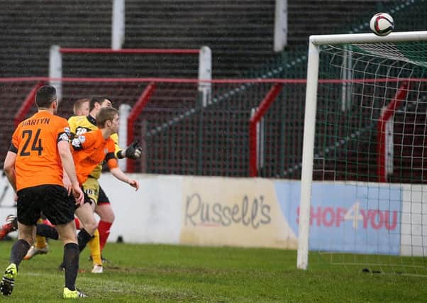 Rhys Marshall heads Glenavon into the lead at Oval.
