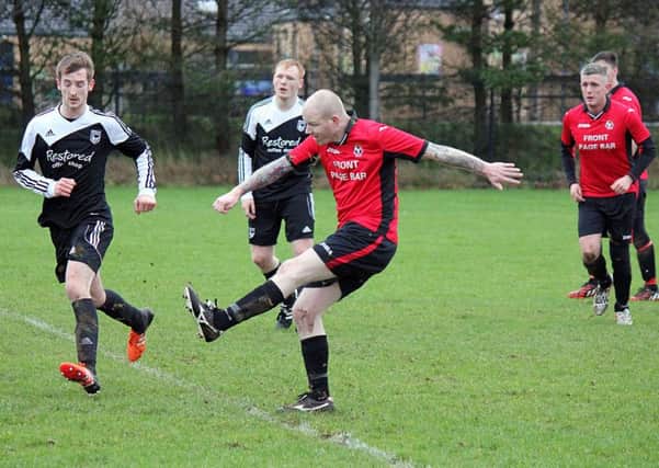 Woodside on the attack in Saturday's Rainey Cup tie against Sporting Ballymoney at Ballykeel. INBT 07-805H