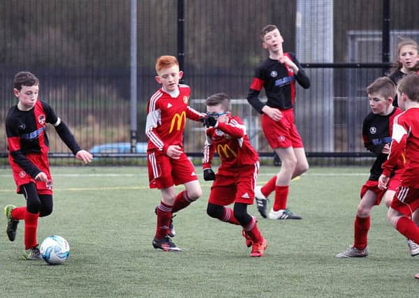Carniny Youth U-12s quickly close down Fivemiletown during Saturday's NIBFA Cup tie at the Showgrounds. INBT 07-832H