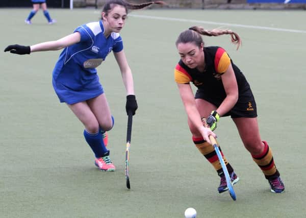 Lurgan's Joanne Wilson keeps control of the ball as Portadown's Emily Parks moves in. INLM06-626AM