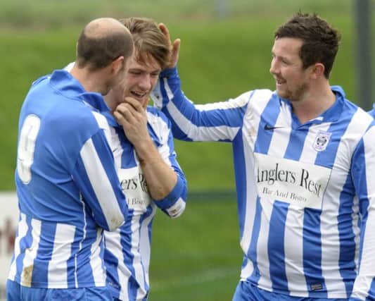 Goal-scorer Gareth Rees (centre) has been in top form since netting twice against Glentoran Reserves before Christmas.