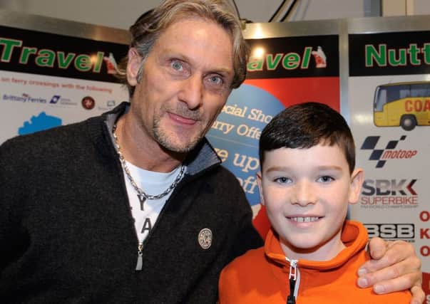 Lewis Seeley, son of East Antrim rider Alastair Seeley, meets Carl Fogarty at the Blackhorse Motorcyle Festival. INLT 06-917-CON