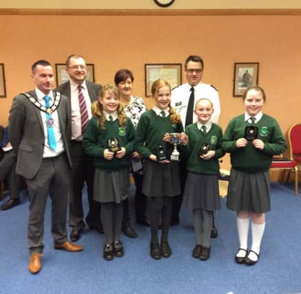 The Oakfield Primary School team with the Deputy Mayor of Mid and East Antrim Council, Councillor Timothy Gaston; George McCluskey, principal Oakfield PS; Patricia Johnston, Carrickfergus Road Safety Committee and Constable David Maguire. INCT 06-759-CON