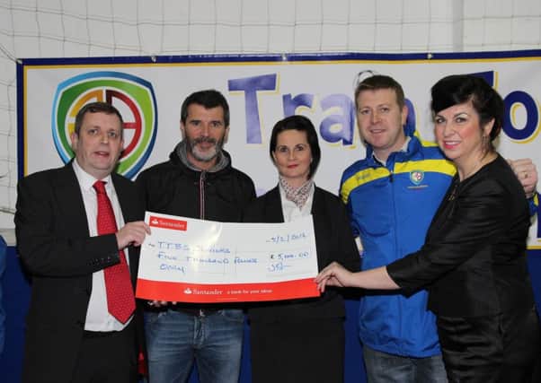 Pat McGibbon (second right) with special guest Roy Keane (second left) and representatives from Santander during a cheque presentation.