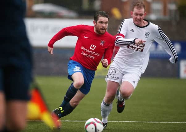 Annagh United captain Richard Allen (right) edging the race for a loose ball against Ards. Pic by PressEye Ltd.