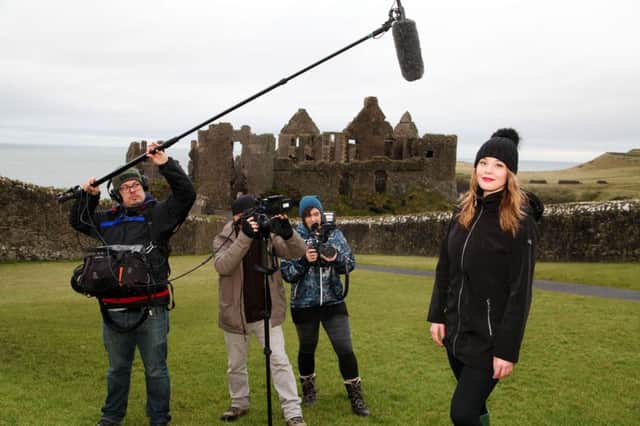 Morgan Hoffman, presenter of InnerSpace (right), filming at Dunluce Castle. 
Pic: Paul Nash
