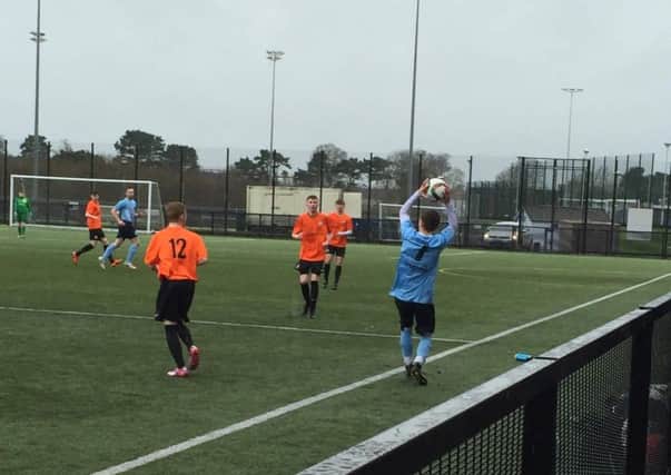 Stewart Nixon throws the ball up the line during Ballymena United under-19s' weekend win over Glenavon.