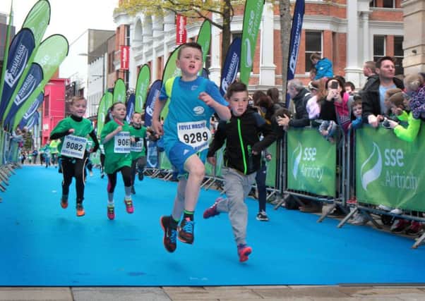 Just a skip from home as children sprint the last few metres to the end of the Walled City Marathon mini race last year. Picture Margaret McLaughlin