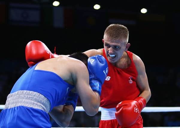 Lisburn's Kurt Walker (red) competes against Bakhtovar Nazirov of Russia (blue) in the Men's Boxing Bantam 56kg round of 32 bout of the Baku 2015 European Games at Crystal Hall in Baku, Azerbaijan. Photo by Richard Heathcote/Getty Images for BEGOC