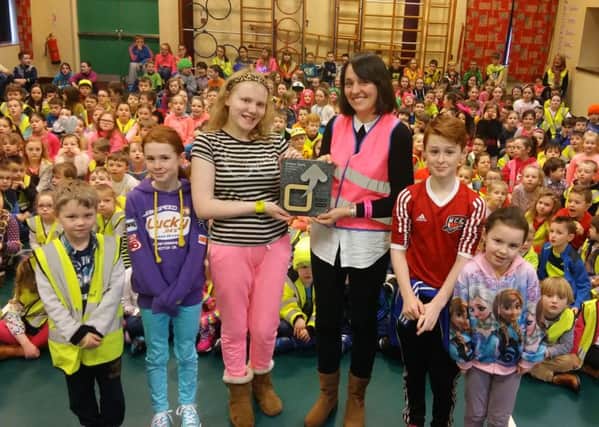 Julie Bryson, Teacher and Sustrans School Champion, pictured with the children of Drumahoe Primary School after they received their Silver Award from Sustrans and staged a Ditch the Dark event to celebrate.