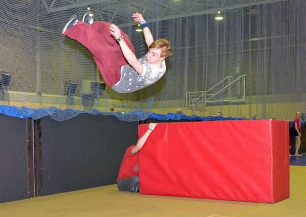 Carrickfergus student and freerunner, Ryan Luney demonstrates his reverse vault with a distance of 4.427 metres in a bid to beat the Guinness world record. INCT 07-009-PSB