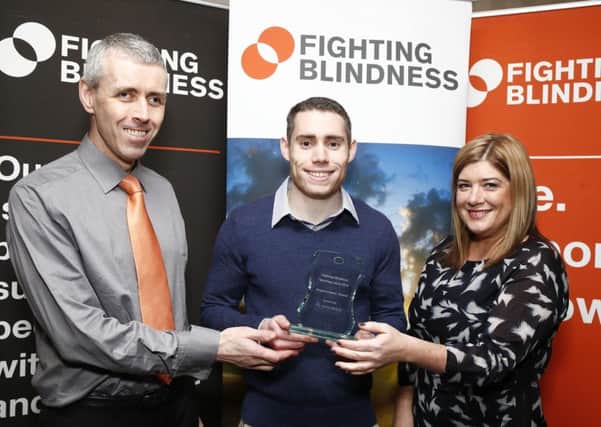 Jason Smyth (centre) Fastest Paralympian on the Planet and winner of the Fighting Blindness Empowerment Award 2016, supported by Novartis, pictured with Tony Ward, Fighting Blindness and Doreen Curran, Novartis. Picture Conor McCabe Photography.